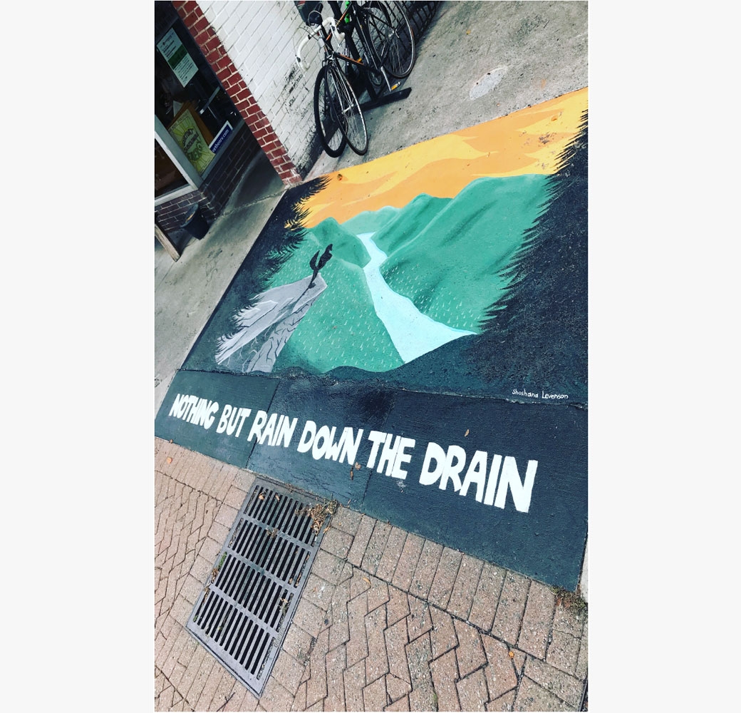 Design with “Nothing But Rain Down the Drain” written in bold